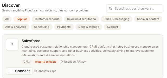 The Discover section with a search box, category chips, and a Salesforce card tagged Imports contacts and Needs an API key with a Connect button